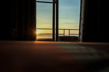 Morning in room with sunrise at window