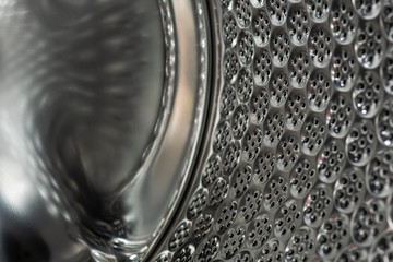 metallic texture of front load washing machine drum