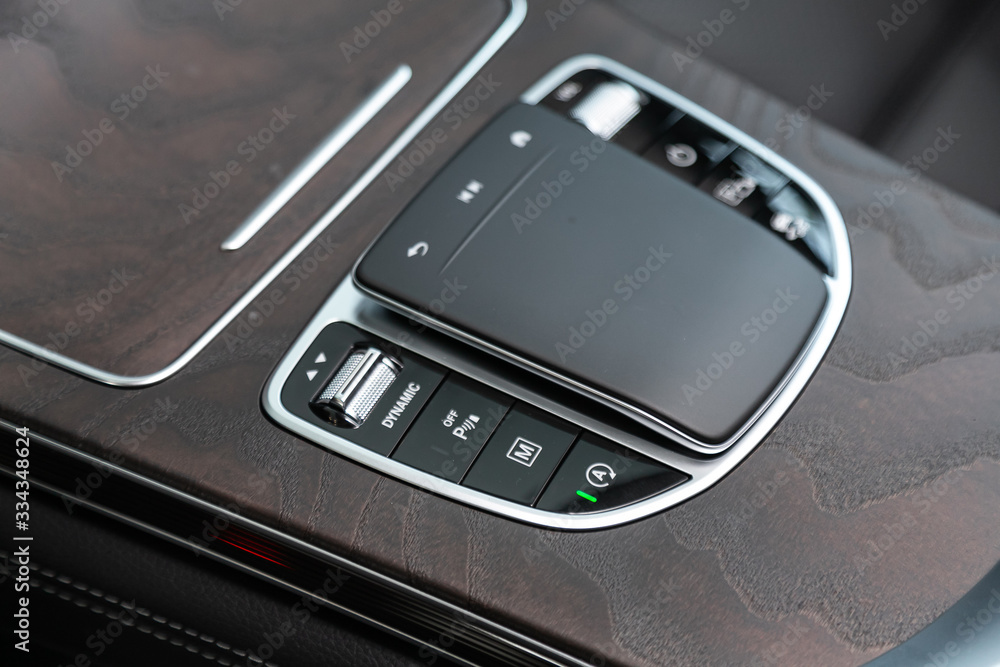 Aufkleber close up of the manual gearbox transmission handle. accelerator handle and buttons in a new car. .