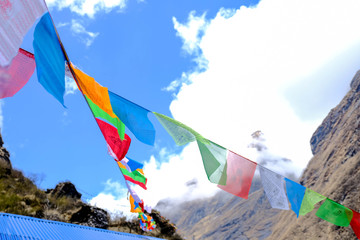 Colorful prayer flags in Himalayas cloud sky