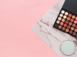  Eyeshadow palette and miror on pink and mottle background