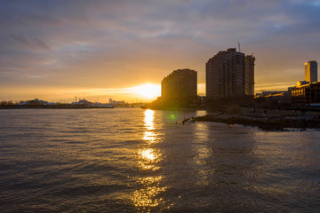 Fototapeta premium Aerial photograph of Jersey waterfront with the Hudson Rivers at Sunset