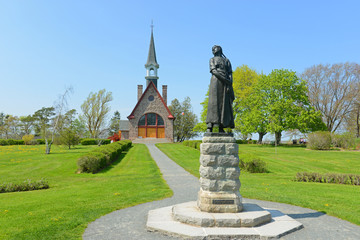 Memorial Church in Grand Pre National Historic Site, Wolfville, Nova Scotia, Canada. Grand-Pré area is a center of Acadian settlement from 1682 to 1755. Now this site is a UNESCO World Heritage Site. - obrazy, fototapety, plakaty
