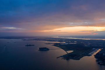 Aerial photograph of Jersey Ellis Island with the Hudson Rivers at Sunset, New York 