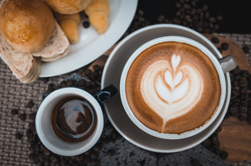 Closeup Coffee latte art with bread