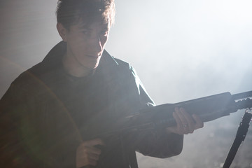 A man with a gun in his hands 