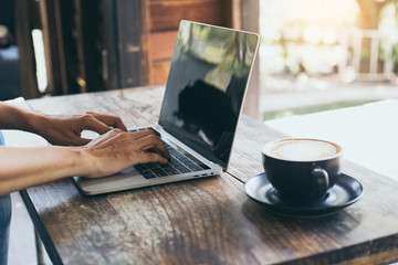 using computer.hand typing message on keyboard laptop online chatting search information form internet while working on laptop concept for technology device contact communication business people