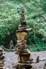 Fototapeta na wymiar Pile of rock stacked in balance with each other to form a tower, an ancient ritual of good fortune and prosperity.