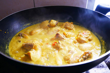 Malaysian Malays traditional cook called Ayam Masak Lemak Chili Padi. It is chicken cooked with a mixture of water, coconut milk, chili turmeric, and water.