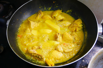 Malaysian Malays traditional cook called Ayam Masak Lemak Chili Padi. It is chicken cooked with a mixture of water, coconut milk, chili turmeric, and water.