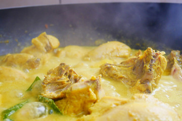 Malaysian Malays traditional cook called Ayam Masak Lemak Chili Padi. It is chicken cooked with a mixture of water, coconut milk, chili turmeric, and water.