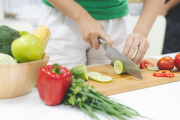 Obraz na płótnie Canvas Close up woman preparing ingredient for salad menu. Dinner diet plate homemade by yourself.