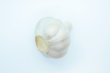 A head of garlic located on a white background