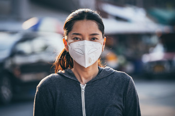 woman wearing a mask vent the outbreak of the virus concept for environmental pollution and health,medical.Insurance for your healthcare,disease,dust,smoke,dirt in the city