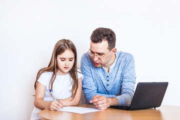 dad and daughter learn via the Internet, remote learning, family help, mom, relatives, time of...