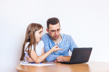 dad and daughter learn via the Internet, remote learning, family help, mom, relatives, time of...