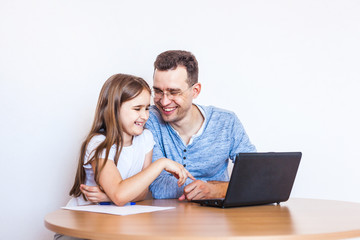 dad and daughter learn via the Internet, remote learning, family help, mom, relatives, time of...