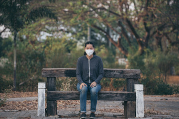 Fototapeta premium woman wearing a mask vent the outbreak of the virus concept for environmental pollution and health,medical.Insurance for your healthcare,disease,dust,smoke,dirt,wildfirein the city
