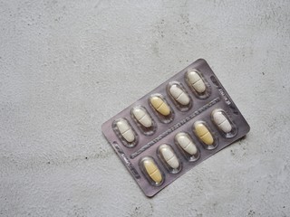 layout of tablets in plastic packaging on a light background