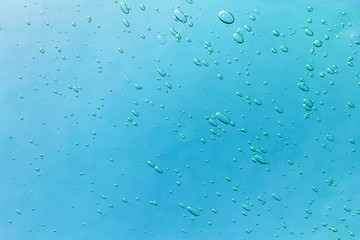Air bubbles close up on a blue background