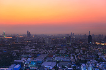 Naklejka premium Cityscape view Twilight Sunset Through Town of Bangkok city It is a modern capital. Bangkok Thailand