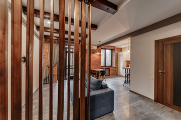 Interior of a modern loft style apartment. Living room and kitchen