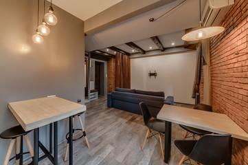 Interior of a modern loft style apartment. Living room and kitchen