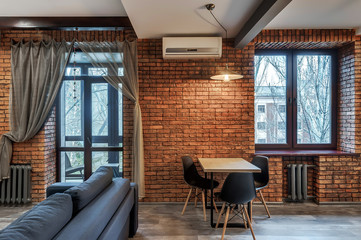 Interior of a modern loft style apartment. Living room and kitchen