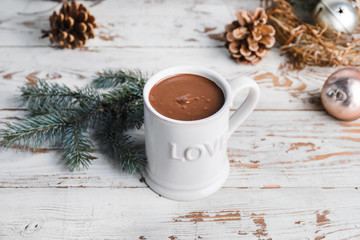 Obraz na płótnie Canvas Cup of hot chocolate and Christmas decor on table