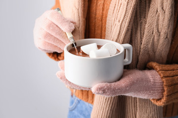Woman with cup of hot chocolate, closeup