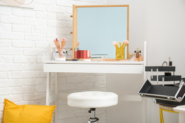 Workplace of makeup artist in interior of modern beauty salon