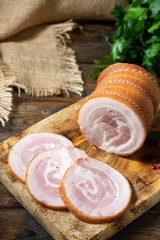 Meatloaf on a wooden Board on a brown wooden table. Baked meat. The view from the top. Rustic style	