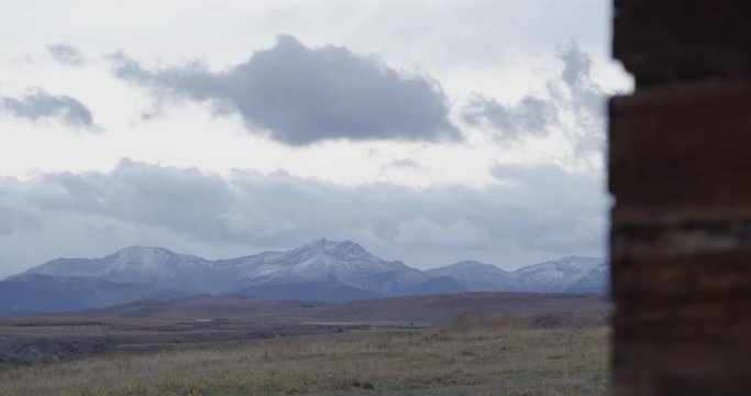 Prairie Field leading to a Mountain Range with Foreground