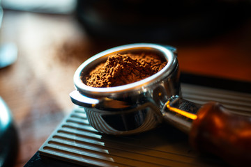 grinding coffee arabica in the portafilter 