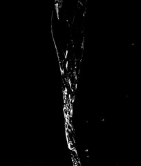 Water jet on a black background.