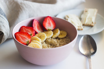 Tasty breakfast. Oatmeal with banana and strawberries