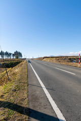 Fototapeta premium Straight road under the sun shine.