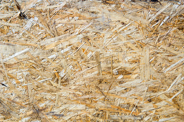 Close up of a recycled compressed wood chippings board