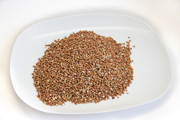 mountain of buckwheat on a white background
