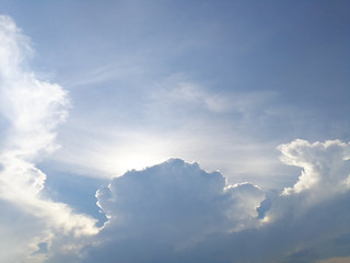 Dramatic clouds in the blue sky, scenic sky with sunlight.