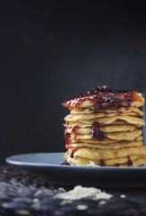 stack of pancakes with raspberry jam