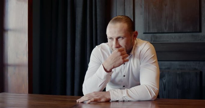 Male entrepreneur planning mischief in office