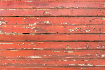 Old wooden planks painted red as a natural background or texture.