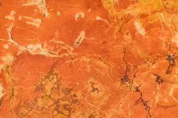 Red, orange and yellow marble texture. Stone background seamless pattern