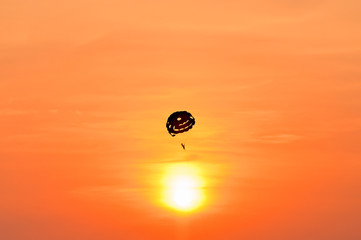 Beach parachute at sunset