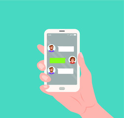 Hand holding mobile with live chat messenger app on screen.