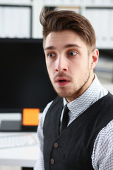 Handsome smiling man in suit and tie stand in office looking in camera portrait. White collar dress code modern lifestyle graduate college study profession idea coach training concept