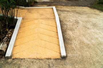 Concrete ramp way for wheelchair disabled person in the park. Wh