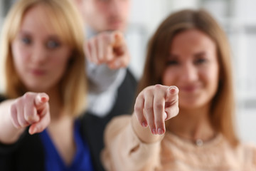 A group of business people pointing their finger at the camera and saying we choose you are engaged in a posse of employees and selecting the prosessians for the customer.