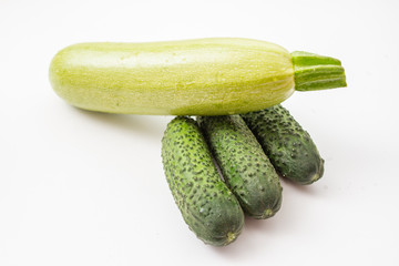 fresh vegetables, zucchini and cucumbers on a white background
